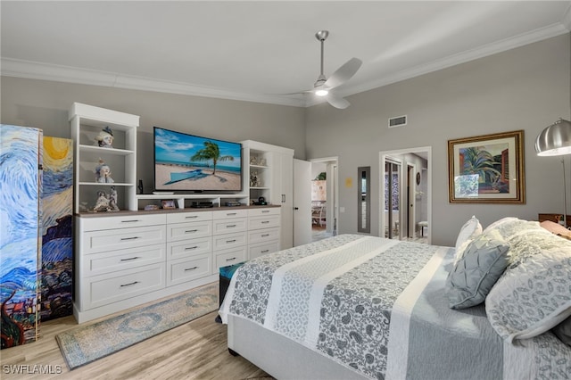 bedroom with ceiling fan, lofted ceiling, crown molding, and light hardwood / wood-style flooring