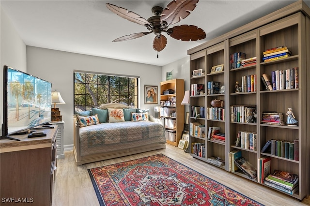 sitting room featuring ceiling fan and light hardwood / wood-style flooring