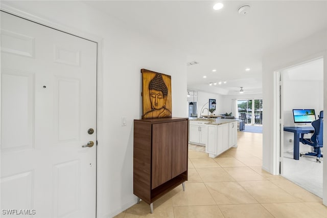 505 Mardel Dr Unit 112, Naples, FL 34104 - hallway with a sink, recessed lighting, light tile patterned flooring, and baseboards