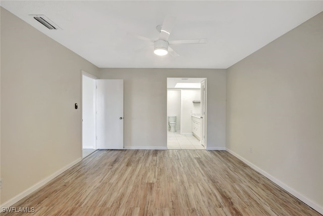 spare room featuring ceiling fan and light hardwood / wood-style floors