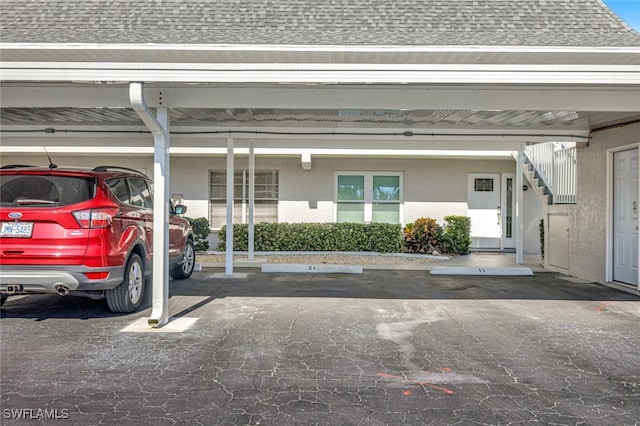 garage featuring a carport