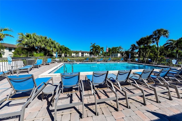 view of swimming pool with a patio area