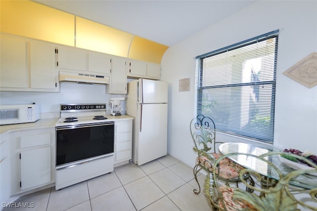 kitchen with white cabinets, white appliances, and light tile patterned floors