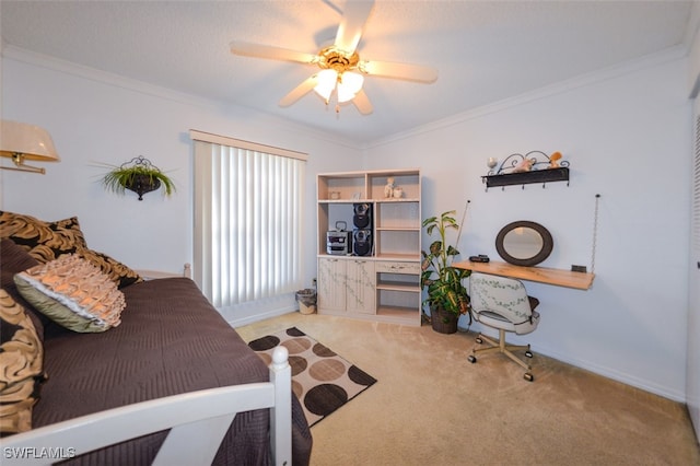 carpeted bedroom with ceiling fan and crown molding