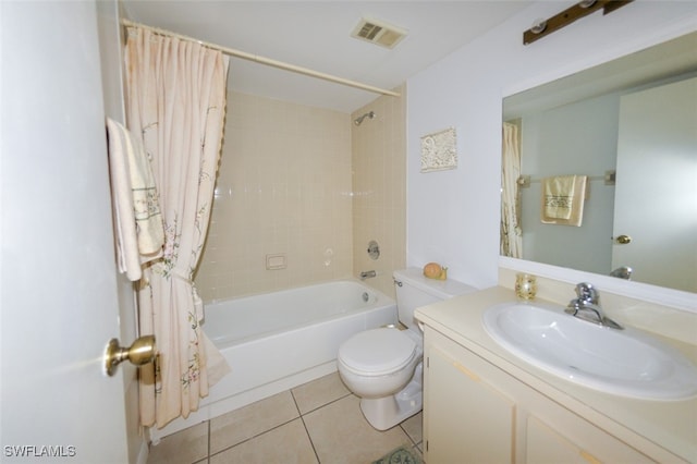 full bathroom featuring tile patterned flooring, shower / tub combo, vanity, and toilet