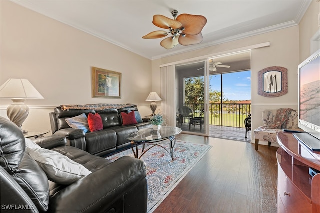 living room featuring dark hardwood / wood-style flooring and ornamental molding