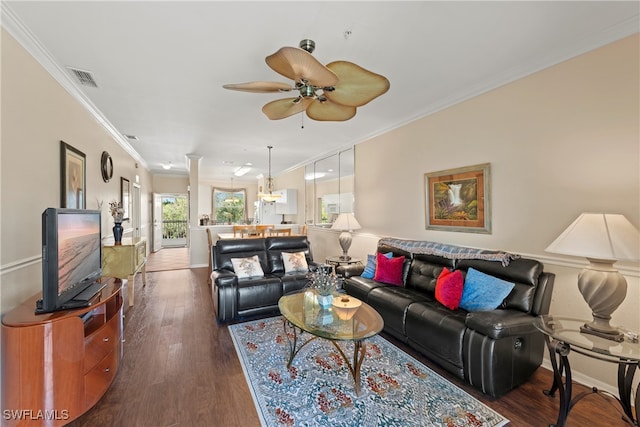 living room featuring ceiling fan, dark hardwood / wood-style flooring, and ornamental molding