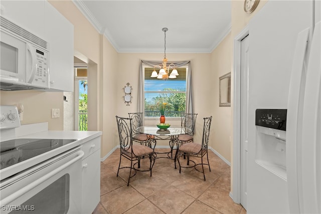 tiled dining area featuring ornamental molding and a chandelier