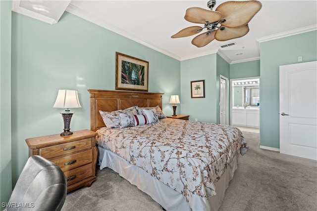 carpeted bedroom featuring ensuite bathroom, ceiling fan, and ornamental molding