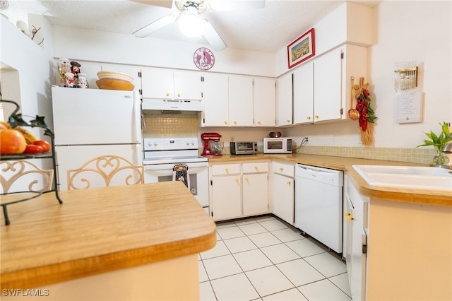 kitchen featuring white cabinets, white appliances, ceiling fan, and sink