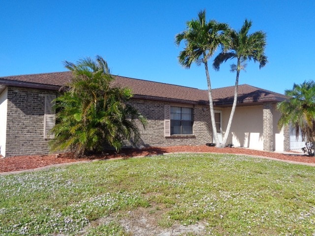 view of front of home with a front yard