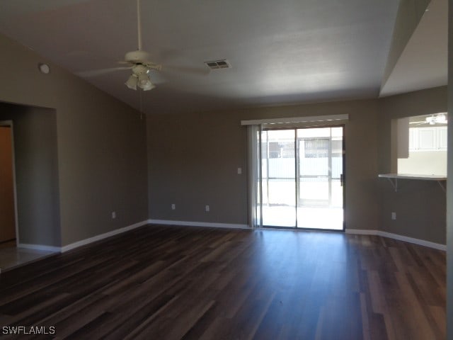 spare room with dark hardwood / wood-style floors and ceiling fan