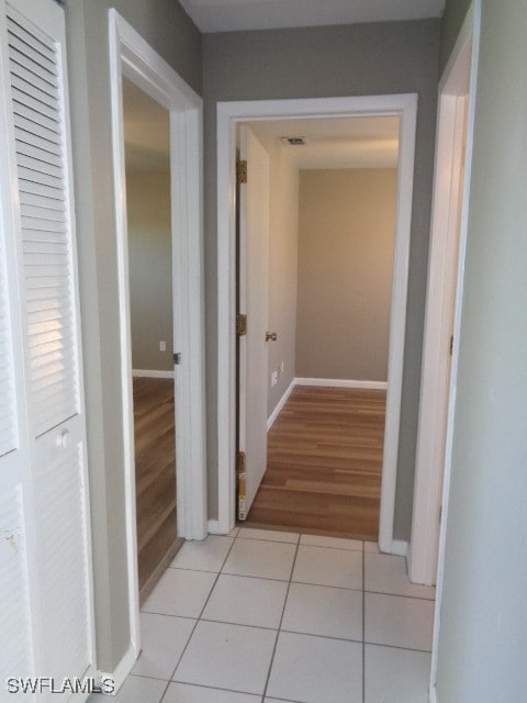 corridor featuring light hardwood / wood-style floors