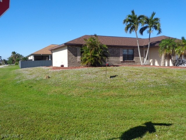 exterior space featuring a front lawn