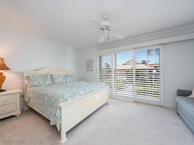 carpeted bedroom with access to outside, ceiling fan, and ornamental molding