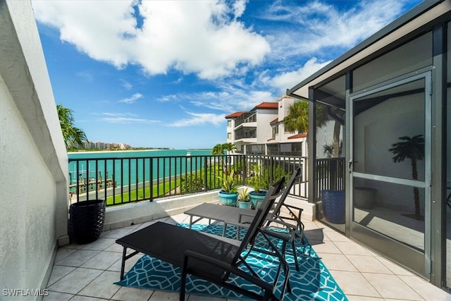 balcony featuring a water view