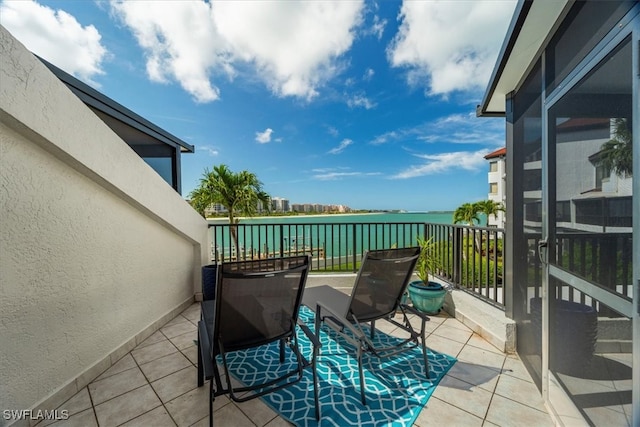 balcony featuring a water view