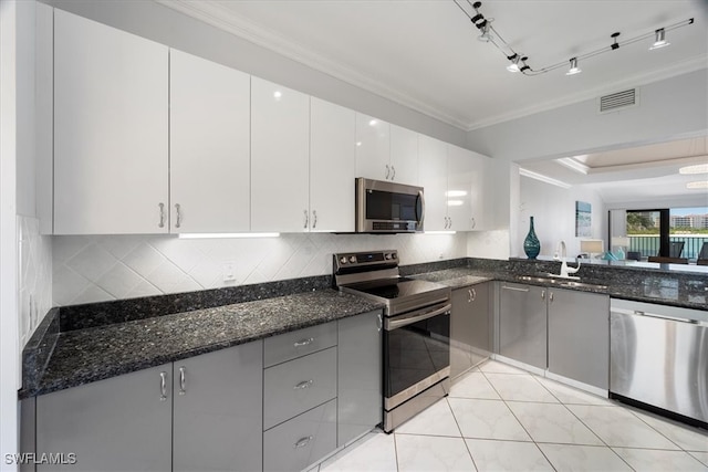 kitchen with white cabinets, gray cabinets, sink, and appliances with stainless steel finishes