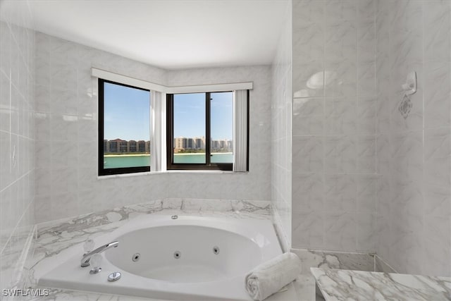 bathroom featuring tiled bath