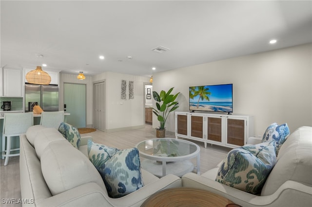 living room with light hardwood / wood-style floors