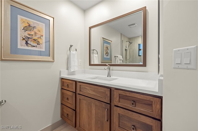 bathroom featuring vanity and a shower