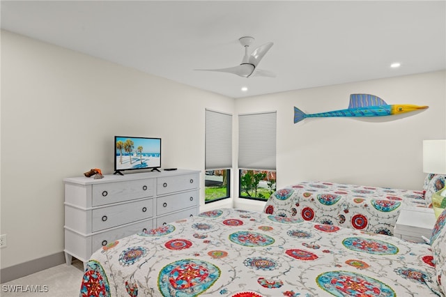 bedroom featuring light carpet and ceiling fan