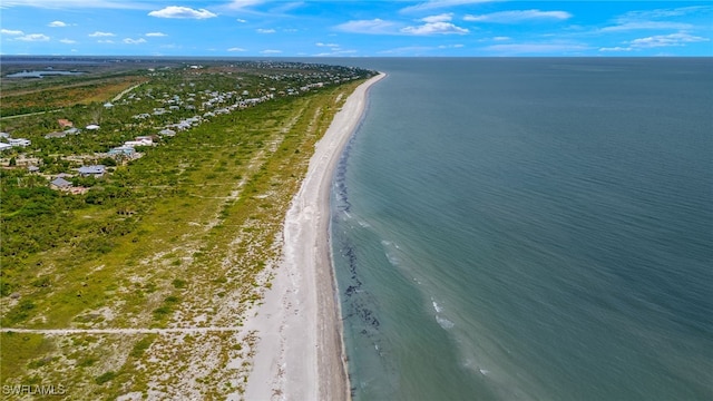 bird's eye view with a water view and a beach view