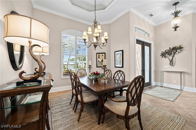 tiled dining area featuring ornamental molding, french doors, and an inviting chandelier