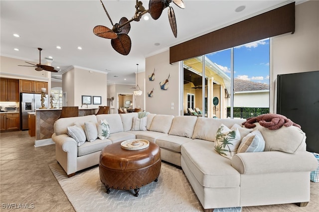 tiled living room featuring crown molding and ceiling fan