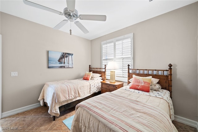 bedroom featuring ceiling fan and light tile patterned flooring