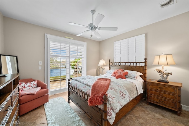 tiled bedroom featuring access to outside and ceiling fan