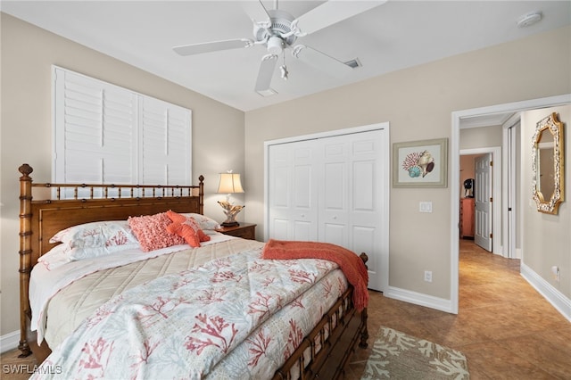 tiled bedroom with a closet and ceiling fan