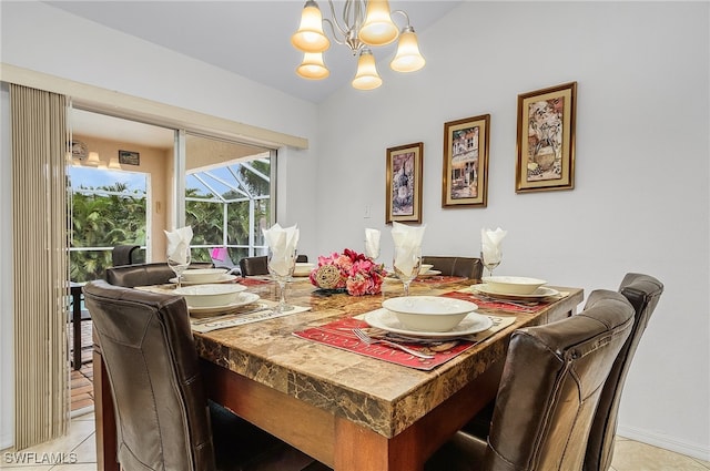 dining area featuring an inviting chandelier and light tile patterned flooring