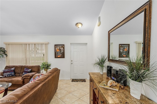 tiled living room with lofted ceiling