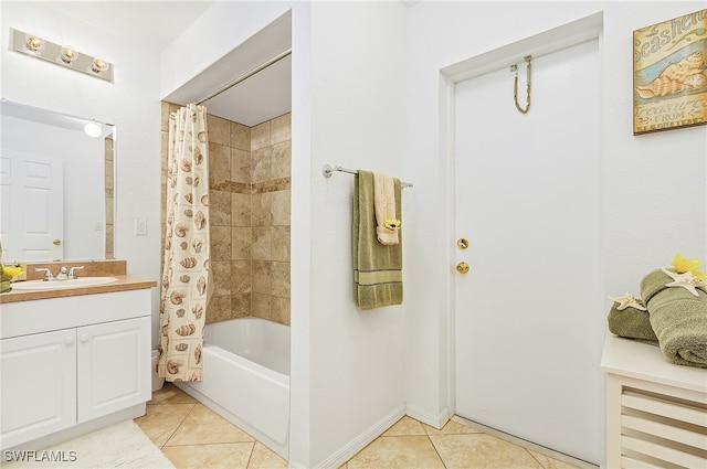 bathroom with tile patterned flooring, shower / bath combo, and vanity