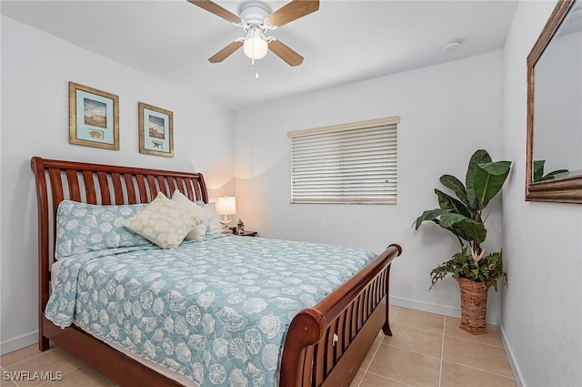 bedroom featuring light tile patterned floors and ceiling fan