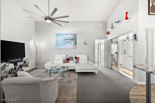 living room with high vaulted ceiling and ceiling fan