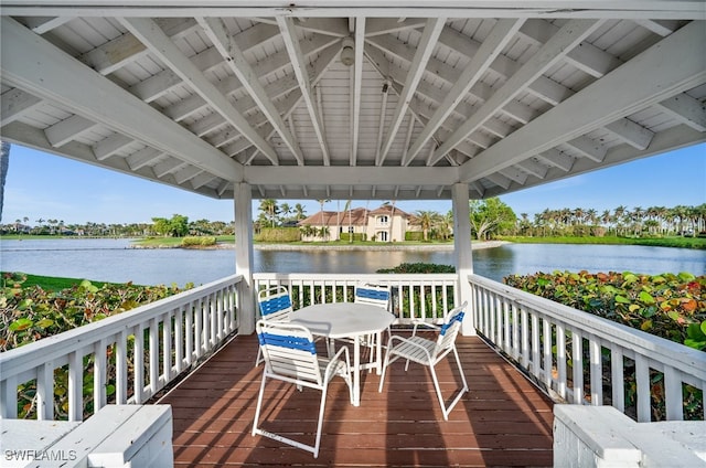 deck with a gazebo and a water view