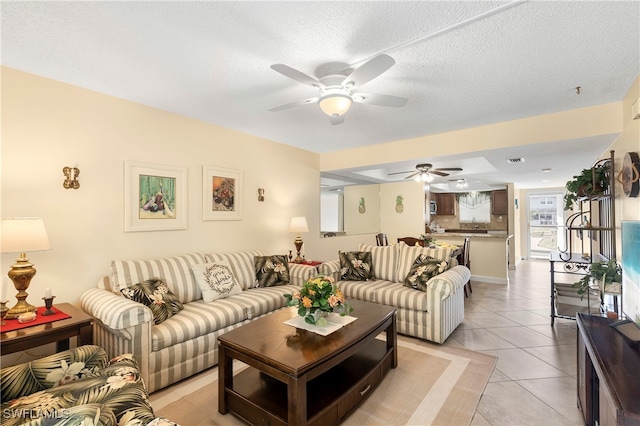 34 Watercolor Way Unit 34, Naples, FL 34113 - living room featuring a ceiling fan, light tile patterned floors, and a textured ceiling