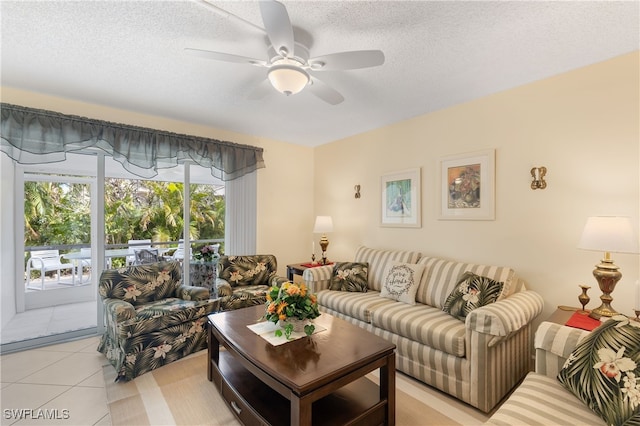 tiled living room featuring a textured ceiling and ceiling fan