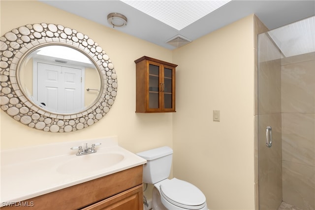 bathroom with vanity, toilet, and an enclosed shower