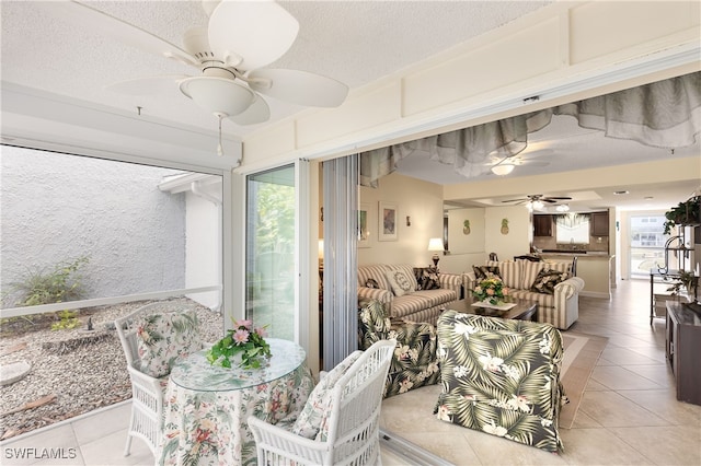 34 Watercolor Way Unit 34, Naples, FL 34113 - living room featuring ceiling fan, light tile patterned floors, and a textured ceiling