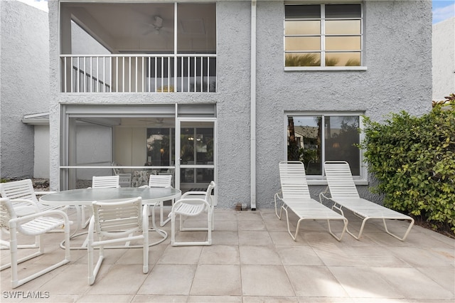34 Watercolor Way Unit 34, Naples, FL 34113 - view of patio / terrace featuring a balcony, outdoor dining space, and a ceiling fan