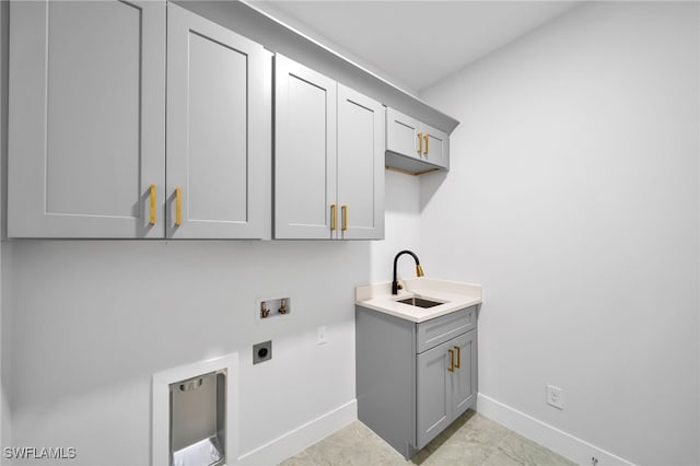 laundry area featuring sink, cabinets, electric dryer hookup, hookup for a washing machine, and light tile patterned flooring