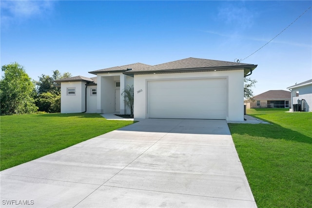 view of front facade featuring a garage and a front lawn