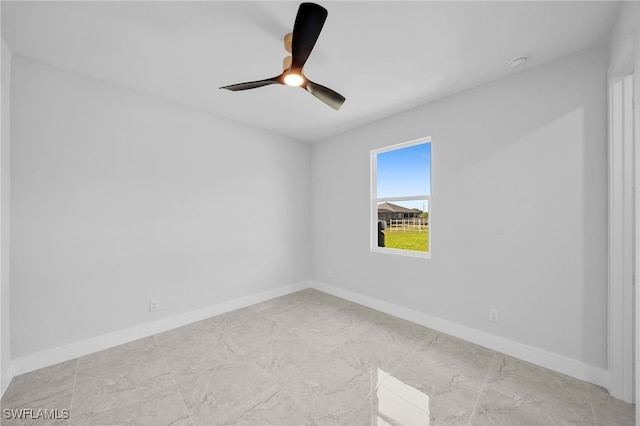 unfurnished room with ceiling fan