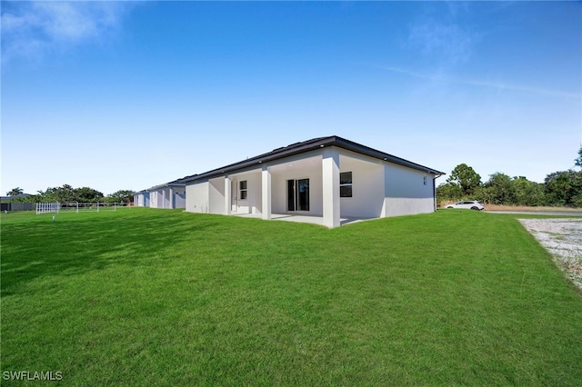 view of home's exterior with a lawn