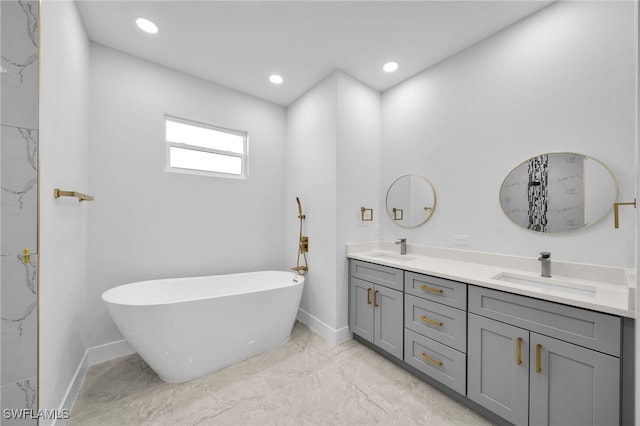 bathroom with a bathing tub and vanity