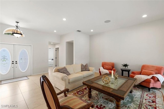 living room featuring light tile patterned flooring and french doors