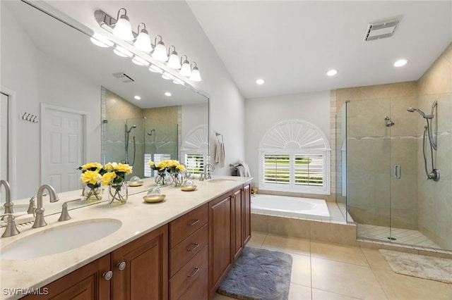 bathroom with tile patterned floors, separate shower and tub, and vanity